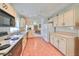 Galley style kitchen with ample counter space and appliances at 812 Mccallister Ave, Sun City Center, FL 33573