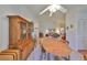 Bright dining room features a wooden table with chairs and built-in hutch at 812 Mccallister Ave, Sun City Center, FL 33573