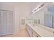 Clean bathroom with double vanity, large mirror and good storage at 812 Mccallister Ave, Sun City Center, FL 33573