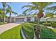 Single-story home with a two-car garage and well-manicured lawn at 812 Mccallister Ave, Sun City Center, FL 33573