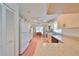 White kitchen with stainless steel appliances and tile floor at 812 Mccallister Ave, Sun City Center, FL 33573