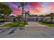 Single-story home with a two-car garage and well-manicured lawn at 812 Mccallister Ave, Sun City Center, FL 33573