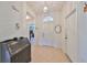 Bright entryway with tiled flooring and a vintage desk at 812 Mccallister Ave, Sun City Center, FL 33573