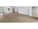 Open living space with tile floors and views into the kitchen area at 20303 Symphony Pl, Venice, FL 34293