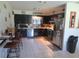 Retro kitchen with dark cabinets, wood countertop, and stainless steel appliances at 10311 Us Highway 98, Dade City, FL 33525