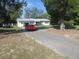 Ranch-style home with carport and spacious yard at 10311 Us Highway 98, Dade City, FL 33525
