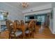 Spacious dining room with hardwood floors, chandelier, and view into the living room at 5297 Huntington Ne St, St Petersburg, FL 33703