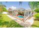 Enjoy the refreshing pool with a screened enclosure and patio at 4504 Horseshoe Pick Ln, Valrico, FL 33594