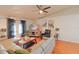 Living room with large sectional sofa and hardwood floors at 4504 Horseshoe Pick Ln, Valrico, FL 33594