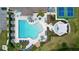 Aerial view of community pool, tennis courts, and lounge areas at 17206 White Mangrove Dr, Wimauma, FL 33598