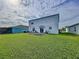 Large backyard with a patio and garden at 17206 White Mangrove Dr, Wimauma, FL 33598