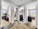 Bright hallway with carpet and access to several rooms at 17206 White Mangrove Dr, Wimauma, FL 33598