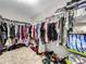 Large walk-in closet with ample shelving and hanging space at 17206 White Mangrove Dr, Wimauma, FL 33598