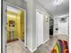 Small bathroom with pedestal sink and yellow walls at 17206 White Mangrove Dr, Wimauma, FL 33598