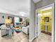 Open living room with colorful rug and off-white couches at 17206 White Mangrove Dr, Wimauma, FL 33598