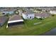 Aerial view showcasing home, garden, and solar panels at 17206 White Mangrove Dr, Wimauma, FL 33598