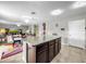 Spacious kitchen with granite countertops and dark wood cabinets at 17206 White Mangrove Dr, Wimauma, FL 33598