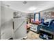 Home theater with large TV and wall of movies at 17206 White Mangrove Dr, Wimauma, FL 33598