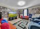 Entertainment room featuring a large screen TV and comfortable seating at 17206 White Mangrove Dr, Wimauma, FL 33598