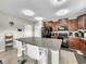 Modern kitchen featuring black appliances and an island at 17206 White Mangrove Dr, Wimauma, FL 33598