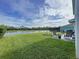 Backyard with patio, garden, and pond view at 17206 White Mangrove Dr, Wimauma, FL 33598