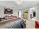 Spacious bedroom with a large bed and plenty of natural light at 17206 White Mangrove Dr, Wimauma, FL 33598