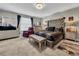 Primary bedroom with tufted headboard and stylish decor at 17206 White Mangrove Dr, Wimauma, FL 33598