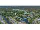 Stunning aerial view of waterfront homes and lush surroundings, near Gulf of Mexico, highlighting the community's unique location at 5369 Tuscawilla Dr, Weeki Wachee, FL 34607