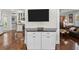 White kitchen cabinets and a built-in entertainment center at 2010 W Dekle Ave, Tampa, FL 33606