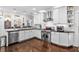 Modern kitchen with white cabinets, stainless steel appliances, and granite countertops at 2010 W Dekle Ave, Tampa, FL 33606