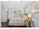 Spacious bedroom with a queen-size bed and large windows at 2010 W Dekle Ave, Tampa, FL 33606