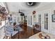 Large screened porch with hardwood floors, ceiling fan and comfortable seating at 2010 W Dekle Ave, Tampa, FL 33606