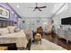 Spacious main bedroom with hardwood floors, vaulted ceiling, and access to outdoor space at 2010 W Dekle Ave, Tampa, FL 33606