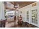 Relaxing front porch with a porch swing, bistro table and chairs at 2010 W Dekle Ave, Tampa, FL 33606