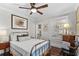 Bright bedroom with hardwood floors, a comfortable bed, and ample natural light at 2010 W Dekle Ave, Tampa, FL 33606