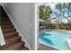Inviting pool area with lush tropical landscaping at 2010 W Dekle Ave, Tampa, FL 33606