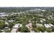 Aerial view showing home's location in a residential neighborhood with lush tree cover at 2010 W Dekle Ave, Tampa, FL 33606