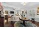 Bright living room featuring hardwood floors, comfortable seating, and a fireplace at 2010 W Dekle Ave, Tampa, FL 33606