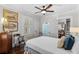 Comfortable bedroom with hardwood floors and access to another room at 2010 W Dekle Ave, Tampa, FL 33606