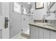 Updated bathroom with a walk-in shower and granite vanity at 2010 W Dekle Ave, Tampa, FL 33606