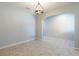 Bright dining area with tile floors and light blue walls at 7110 N Taliaferro Ave, Tampa, FL 33604