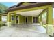 Covered carport with attached garage, offering ample parking and storage at 7110 N Taliaferro Ave, Tampa, FL 33604