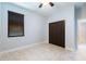 Bedroom with double door closet and tile floors at 7110 N Taliaferro Ave, Tampa, FL 33604