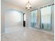 Bright dining area with tile floors and light blue walls at 7110 N Taliaferro Ave, Tampa, FL 33604