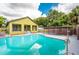 Stunning pool with a large backyard and home in view at 7110 N Taliaferro Ave, Tampa, FL 33604