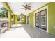 Covered patio with pool access and ceiling fans at 7110 N Taliaferro Ave, Tampa, FL 33604
