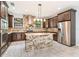 Modern kitchen with granite island and stainless steel appliances at 7110 N Taliaferro Ave, Tampa, FL 33604