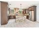 Modern kitchen with granite island and stainless steel appliances at 7110 N Taliaferro Ave, Tampa, FL 33604