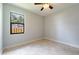 Bright bedroom with tile floors and ceiling fan at 7110 N Taliaferro Ave, Tampa, FL 33604