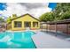 Home with refreshing pool and covered patio at 7110 N Taliaferro Ave, Tampa, FL 33604